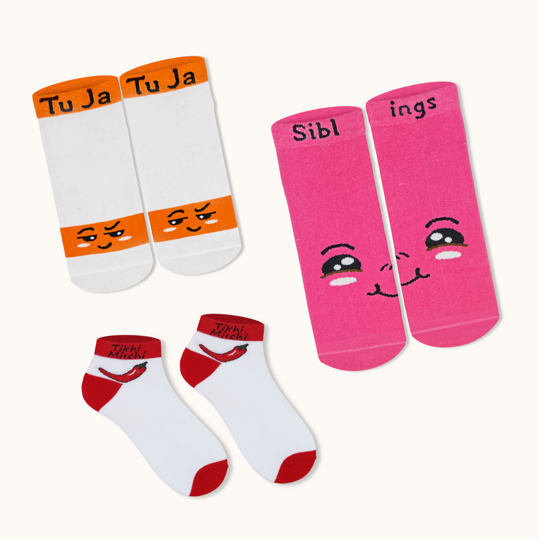 Set of three pairs of socks with cartoon faces and text on a white background
