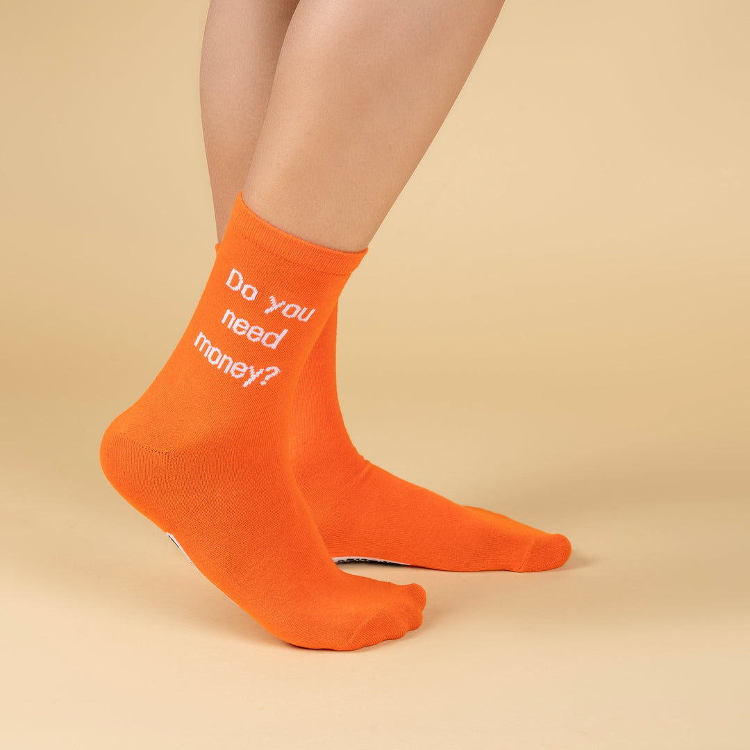 Orange socks with text on a beige background