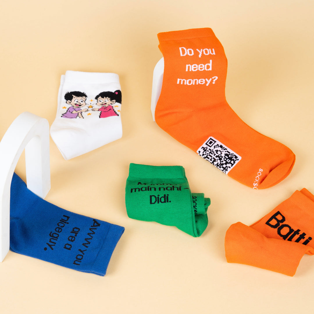 Collection of colorful socks with various designs on a beige background