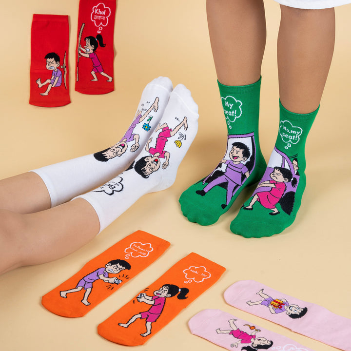 Colorful socks with cartoon characters on a beige background
