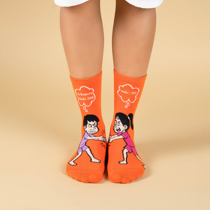 Orange socks with cartoon characters on a beige background