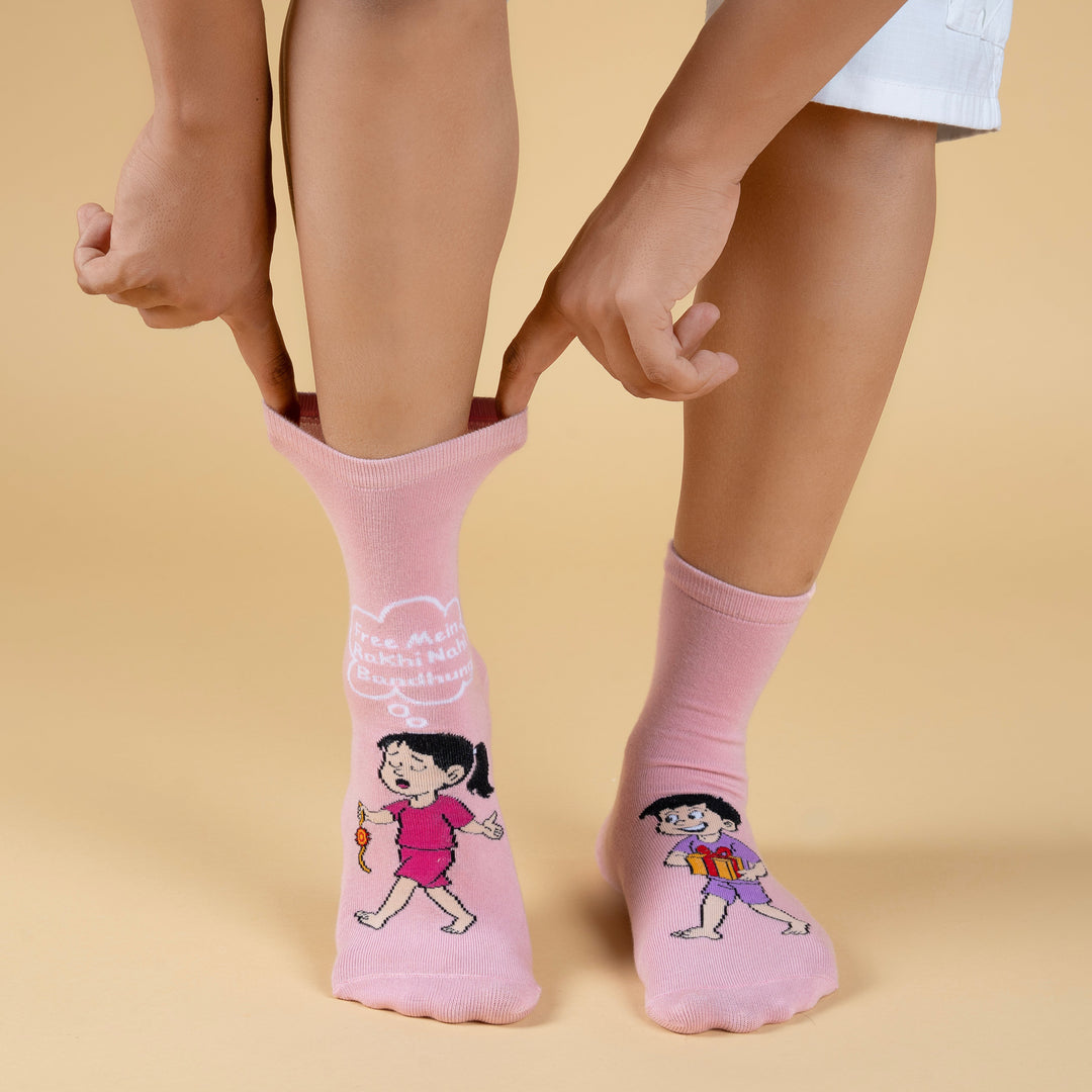 Pink socks with cartoon character design worn by a person on a beige background