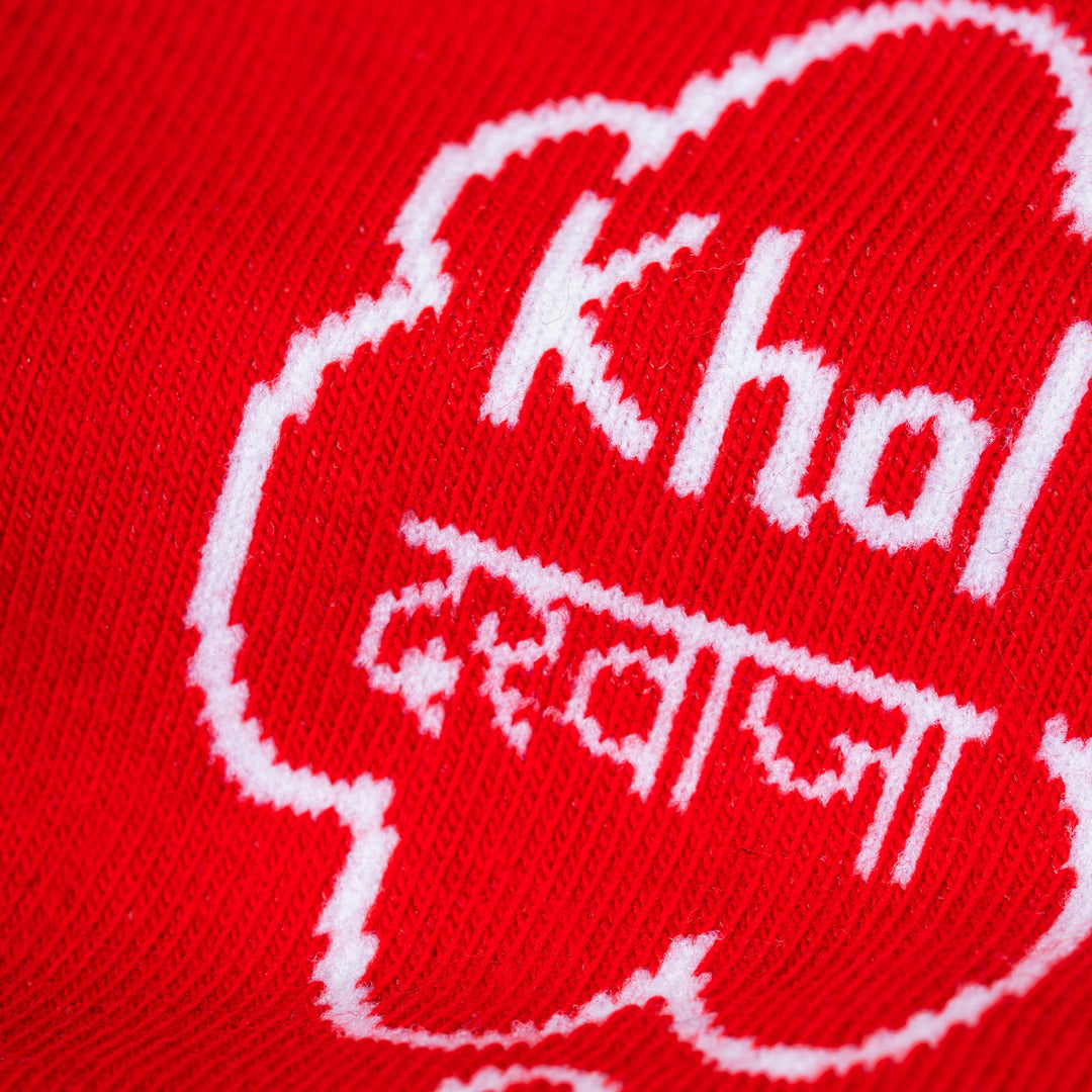 Red fabric with white text and design, including the word &