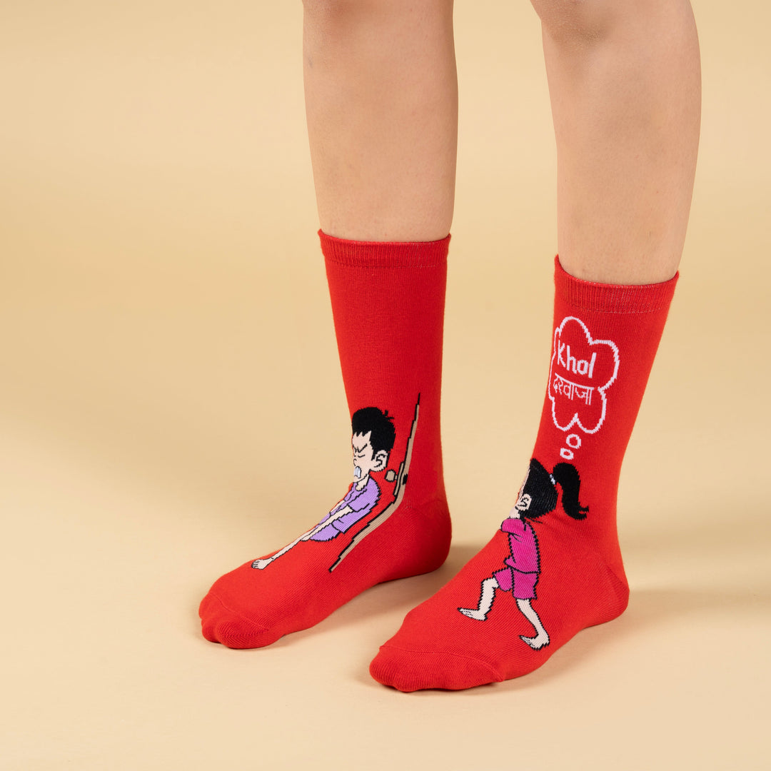 Red socks with cartoon designs on a beige background