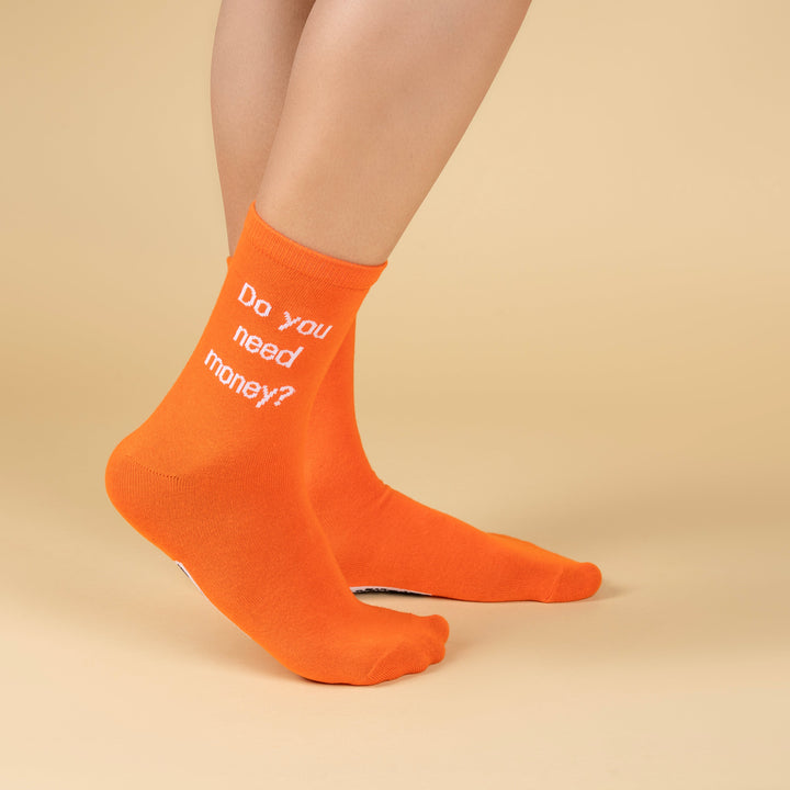 Orange socks with text on a beige background-Emotional Blackmail Edition- DIALOGUE SOCKS-