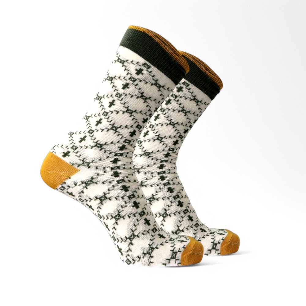 Yellow and green Derp Edition socks worn with casual shoes for fashion and comfort